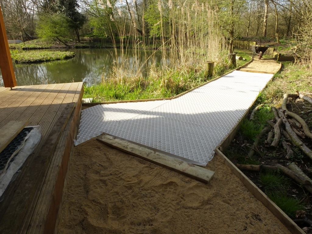 White Grid Panels are laid on the sand bed